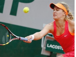 Eugenie Bouchard of Westmount returns the ball during the fourth round match of the French Open tennis tournament against Germany’s Angelique Kerber at the Roland Garros stadium, in Paris, France, Sunday, June 1, 2014.