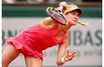 Eugenie Bouchard of Westmount serves during her women’s singles match against Angelique Kerber of Germany on day eight of the French Open at Roland Garros on June 1, 2014 in Paris, France.