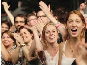 Fans cheer for French musician, singer and songwriter Woodkid as he performed at the opening big free outdoor show at the Montreal International Jazz Festival on Thursday night.Montreal, on Thursday, June 26, 2014.