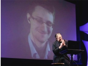 Former NSA contractor Edward Snowden participates in a conversation via video with John Perry Barlow, co-founder & vice chairman of the Electronic Frontier Foundation, at the 2014 Personal Democracy Forum, at New York University, Thursday, June 5, 2014 in New York. (AP Photo/Richard Drew) ORG XMIT: NYRD101