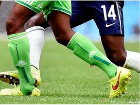 France’s Blaise Matuidi (14) fouls Nigeria’s Ogenyi Onazi during the World Cup round of 16 soccer match between France and Nigeria at the Estadio Nacional in Brasilia, Brazil, Monday, June 30, 2014.