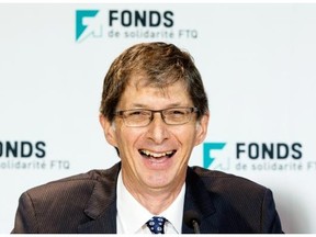 Gaetan Morin laughs as he responds to a question after being introduced as the new president of Quebec’s Fond de Solidarité during a news conference, Thursday, June 26, 2014 in Montreal.