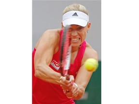 Germany’s Angelique Kerber returns the ball during the fourth round match of the French Open tennis tournament against Eugenie Bouchard of Westmount at the Roland Garros stadium, in Paris, France, Sunday, June 1, 2014.