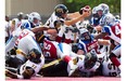 Hamilton Tiger-Cats quarterback Dan LeFevour stretches to score a touchdown during pre-season CFL action in Hamilton, Ont., on Saturday.