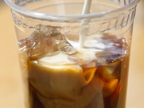 The Dispatch Coffee truck owner Chrissy Durcak, prepares a cold brew coffee in her food truck in Montreal. The frosty version of the normally piping hot drink is gaining popularity. But can it compete with its steamier incarnation?  (Phil Carpenter / THE GAZETTE)