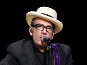 MONTREAL, QUE.: June 29, 2014 -- Singer/songwriter Elvis Costello gives a look reminiscent of an earlier time in his career, he released his first album in 1977, during his solo show at the Maison Symphonique de Montreal as part of  the Montreal International Jazz Festival in Montreal, on Sunday, June 29, 2014. (John Kenney / THE GAZETTE)