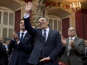 Francois Legault, leader of the second opposition, waves to guests as Coalition Avenir Quebec MNAs  are sworn in at the National Assembly last April. A CROP survey published this week has the CAQ in second place in voter preference, 10 points behind the Liberals and Legault just three points behind Premier Philippe Couillard in popularity. The Parti Quebecois, meanwhile, continues to see its public support dwindle. THE CANADIAN PRESS/Jacques Boissinot