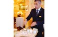 A waiter serves from the cheese board at Paul Bocuse’s Auberge du Pont de Collonges in Lyon.