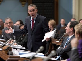 In this file picture from last February, then Quebec Finance Minister Nicolas Marceau defends his government over Quebec Auditor general's report on public finances. Marceau was doing the same thing today as an auditor-general's report found the PQ government had underestimated Quebec's deficit and government spending. THE CANADIAN PRESS/Jacques Boissinot