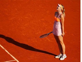 Maria Sharapova of Russia reacts during her women’s singles final match against Simona Halep of Romania on day fourteen of the French Open at Roland Garros on June 7, 2014 in Paris, France.