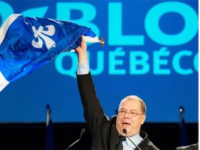 Mario Beaulieu waves a Quebec flag during his speech in Montreal Saturday, June 14, 2014 after being named new leader of the Bloc Québécois.