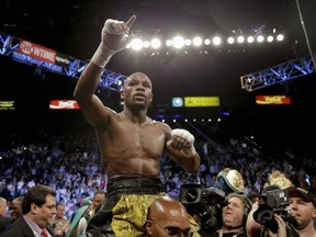 Floyd Mayweather Jr. reacts after defeating Robert Guerrero by unanimous decision in a WBC welterweight title fight, Saturday, May 4, 2013, in Las Vegas. (AP Photo/Isaac Brekken)