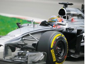 McLaren F1 driver Jenson Button of the U.K. exits turn 10 during the first free practice session for the Canadian Grand Prix at the Circuit Gilles Villeneuve in Montreal on Friday, June 6, 2014.