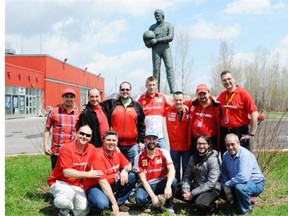 Members of the Scuderia Ferrari Club of Montreal pose for photo.