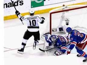 Mike Richards (10) of the Los Angeles Kings celebrates his goal on Henrik Lundqvist (30) of the New York Rangers during the second period of Game Three of the 2014 NHL Stanley Cup Final at Madison Square Garden on June 9, 2014 in New York, New York.