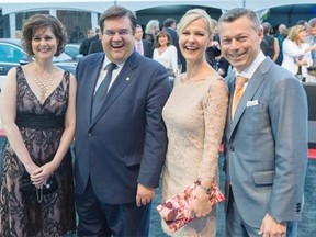 Montreal Mayor Denis Coderre, second from left, and wife Chantale Renaud, left, and Octane CEO and Canadian Grand Prix organizer François Dumontier, right, and wife Charlène, second from right, pose for a photograph at the arrival of The Grand Evening party to kickoff the Canadian Grand Prix weekend at the L’Arsenal in Montreal on Thursday, June 5, 2014.