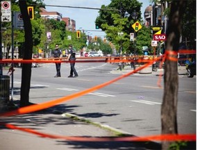Montreal police investigate after the city’s 9th homicide of the year on Saturday, June 7, 2014. The city was hit by four homicides within less than 24 hours on Saturday.