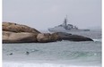 A navy ship patrols the coast near Ipanema beach in Rio de Janeiro, Brazil, Wednesday, June 11, 2014. The World Cup soccer tournament starts Thursday.