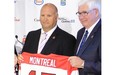 Newly appointed head coach of Canada’s national junior hockey team, Benoit Groulx, left, with Bruce Hamilton of Hockey Canada following announcement in Montreal on Thursday June 12, 2014.