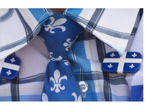 A man dressed in Quebec colours attends the annual St-Jean-Baptiste Day parade in Montreal, Monday, June 24, 2013.