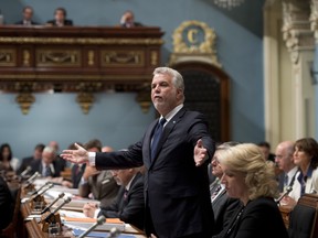 Quebec Premier Philippe Couillard responds to Opposition questions on the helicopter prison escape during question period this week at the legislature in Quebec City. THE CANADIAN PRESS/Jacques Boissinot