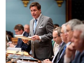 Quebec Municipal Affairs Minister Pierre Moreau tables legislation on retirement plans for city employees, June 12.