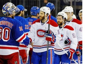 Rangers’ Henrik Lundqvist shakes hands with Canadiens’ Brandon Prust after defeating Montreal 1-0 in Game Six to win the Eastern Conference final at Madison Square Garden on Thursday in New York City.