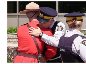 Two RCMP officers exchange an emotional greeting on the eve of Tuesday’s regimental funeral in Moncton for the three RCMP officers killed last week. All major police organizations, including the RCMP, were strong supporters of the long-gun registry, but the Harper government did away with it anyway, writes gun-control advocate Heidi Rathjen. The Quebec portion of the registry survives, thanks to a court injunction.