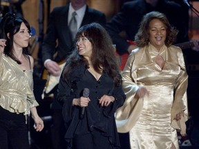 From left, Estelle Bennett, Ronnie Spector (formerly Ronnie Bennett) and Nedra Talley of the Ronettes, performing at their induction into the Rock and Roll Hall of Fame at the Waldorf-Astoria in New York, March 12, 2007. (Robert Caplin/The New York Times)