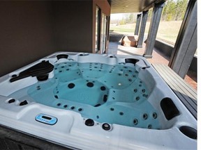 Pictured above is a file photo of an outdoor hot tub. A Quebec man who installed a hot tub in his backyard without bothering to get it approved by the board of the row-housing co-operative where he lived has been ordered to take it out within 30 days and restore the lawn to its former state.