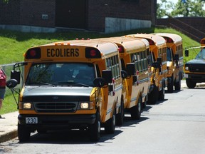 Buses line up outside Mount Pleasant Elementary School in Hudson.
