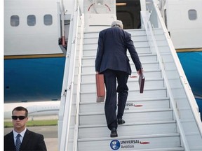 US Secretary of State John Kerry boards his plane at Le Bourget Airport, north of Paris, on June 27, 2014. Kerry will fly on June 27 to Jeddah from Paris where he met on June 26 with Gulf allies and Jordan to discuss the widening crisis in Iraq, as well as the war in Syria. He is due to meet with Saudi King Abdullah to discuss both the wars in Iraq and Syria, and also plans to meet with Syrian opposition leader Ahmad Jarba.