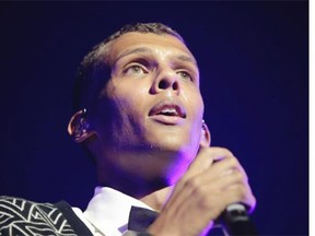 Top-selling Belgian artist Stromae gets a good look at his adoring fans at the Bell Centre in Montreal, on Tuesday, June 17, 2014. One highlight of the evening was a dazzling light show.