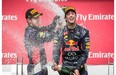 Red Bull F1 driver Daniel Ricciardo of Australia, right, celebrates his first place finish along with teammate Red Bull F1 driver Sebastian Vettel of Germany, left, who finished third, at the Canadian Grand Prix at the Circuit Gilles Villeneuve in Montreal on Sunday, June 8, 2014.