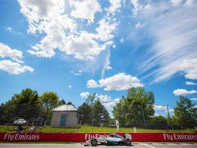 Mercedes F1 driver Nico Rosberg of Germany exits turn 13 during the qualifying session for the Canadian Grand Prix at the Circuit Gilles Villeneuve in Montreal on Saturday, June 7, 2014.