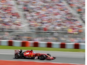 Ferrari F1 driver Fernando Alonso of Spain takes turn two during the Canadian Grand Prix race at the Circuit Gilles Villeneuve in Montreal on Sunday, June 8, 2014.