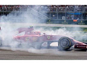 Ferrari driver Kimi Raikkonen from Finland spins at the hairpin, Sunday, June 8, 2014 at the Canadian Grand Prix in Montreal.