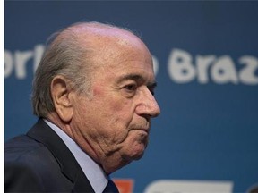 FIFA President Sepp Blatter arrives for a press conference where he talked about the organization and infrastructure of the upcoming World Cup, in Sao Paulo, Brazil, Thursday, June 5, 2014. The World Cup soccer tournament starts on 12 June. (AP Photo/Andre Penner)
