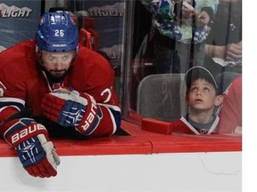 Josh Gorges of the Montreal Canadiens sits at the end of the bench late in the third period during game against New York Rangers on Saturday, May 17, 2014.