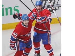 Montreal Canadiens fan Sajda Khan cheers a save by Habs goalie Carey Price while watching Game 7 of Stanley Cup series against the Bruins in Boston, on the big screens at the Bell Centre in Montreal Wednesday May 14, 2014.