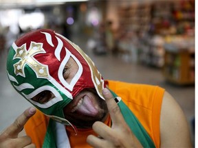 Mexican soccer fan, Herwin Gomez, from Mexico, wears a Lucha libre mask as he arrives at the Rio de Janeiro Galeao International Airport for the World Cup tournament on June 10, 2014 in Rio de Janeiro, Brazil.   Brazil continues to prepare to host the World Cup which starts on June 12th and runs through July 13th.