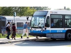 Commuters head to buses after getting off AMT train at Roxboro-Pierrefonds commuter train station in Pierrefonds. Despite spending $5.5 million on studies, the AMT is no closer to a solution to West Island transit woes.