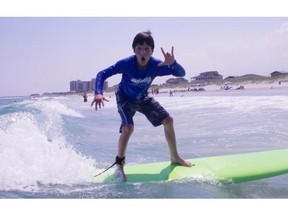 Catching waves at Wrightsville Beach, N.C., where the gradually sloping coastline creates long, low rolling waves well suited for beginners.