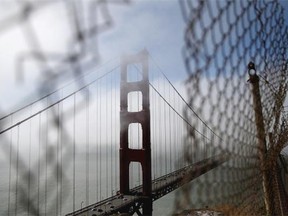 A view of the north tower of the Golden Gate Bridge on June 27, 2014 in Sausalito, California. The Golden Gate Bridge district's board of directors voted unanimously to approve a $76 million funding package to build a net suicide barrier on the iconic span. Over 1,500 people committed suicide by jumping from the iconic bridge since it opened in 1937. 46 people jumped to their death in 2013.