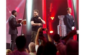 Seth Rogen's bucket list wish is fulfilled at the July 26 gala when surprise guest P.K. Subban brought pitchers of beer to fill the cup for Rogen to swig from. Gazette photo by Vincenzo D'Alto