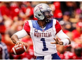 Alouettes quarterback Troy Smith looks for a receiver during first half CFL football action against the Calgary Stampeders in Calgary, Saturday.