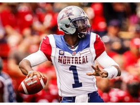 Alouettes quarterback Troy Smith looks for a receiver during first half CFL football action against the Calgary Stampeders in Calgary, Saturday, June 28, 2014.