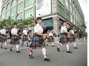 As always, there was also no shortage of bagpipes along Ste-Catherine St. during the Canada Day Parade in downtown Montreal, Tuesday July 1, 2014.