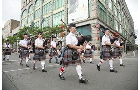 As always, there was also no shortage of bagpipes along Ste-Catherine St. during the Canada Day Parade in downtown Montreal, Tuesday July 1, 2014.
