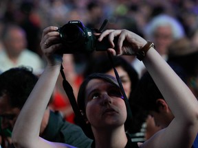 A woman gets her camera ready before the arrival of Canadian Jazz performer Diana Krall at the second big free outdoor concert as part of the Montreal International Jazz Festival in Montreal, on Sunday, June 29, 2014. (John Kenney / THE GAZETTE)